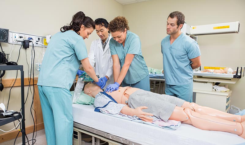 students learning CPR