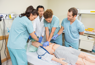 Nurses helping a patient